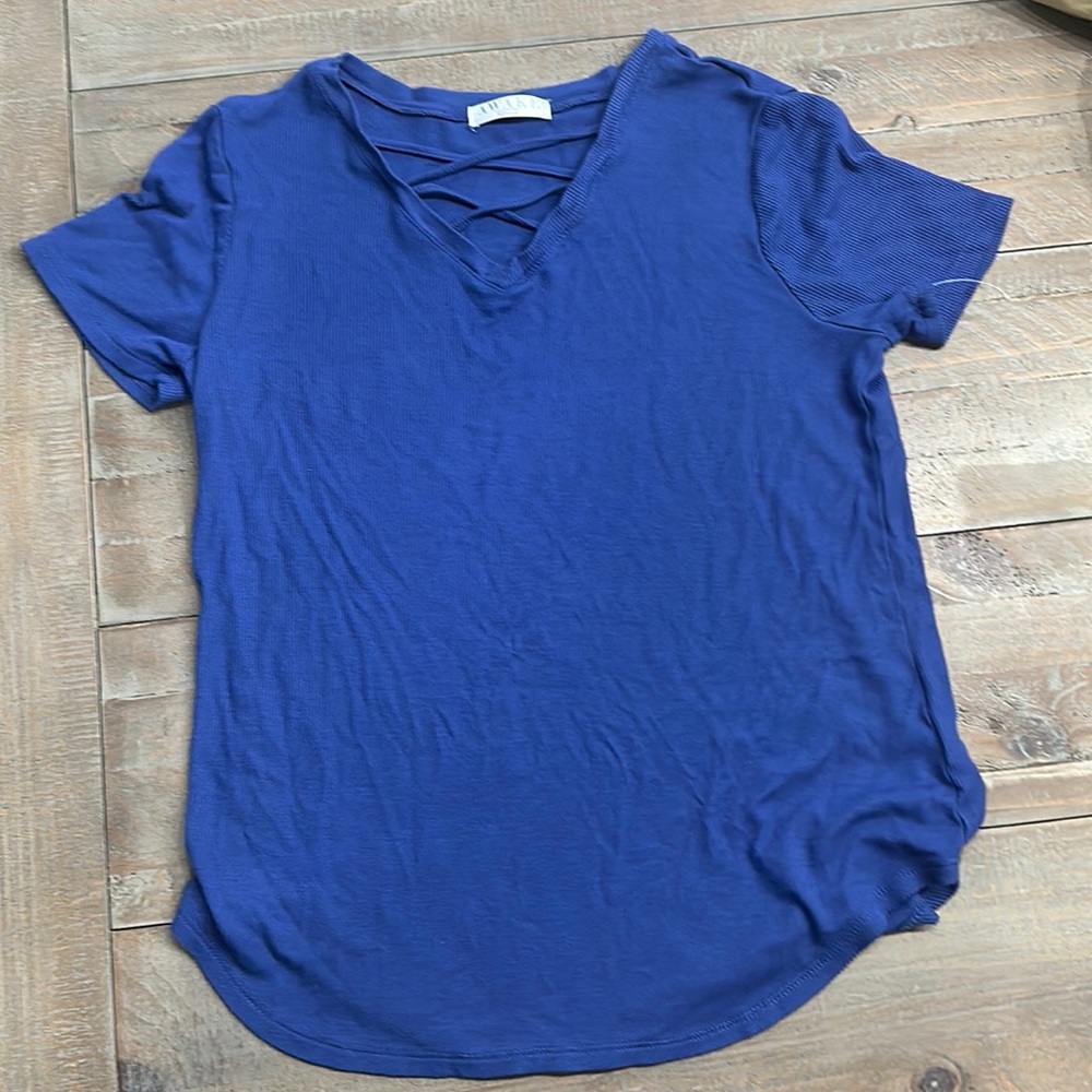 Muted blue with cross cross in chest